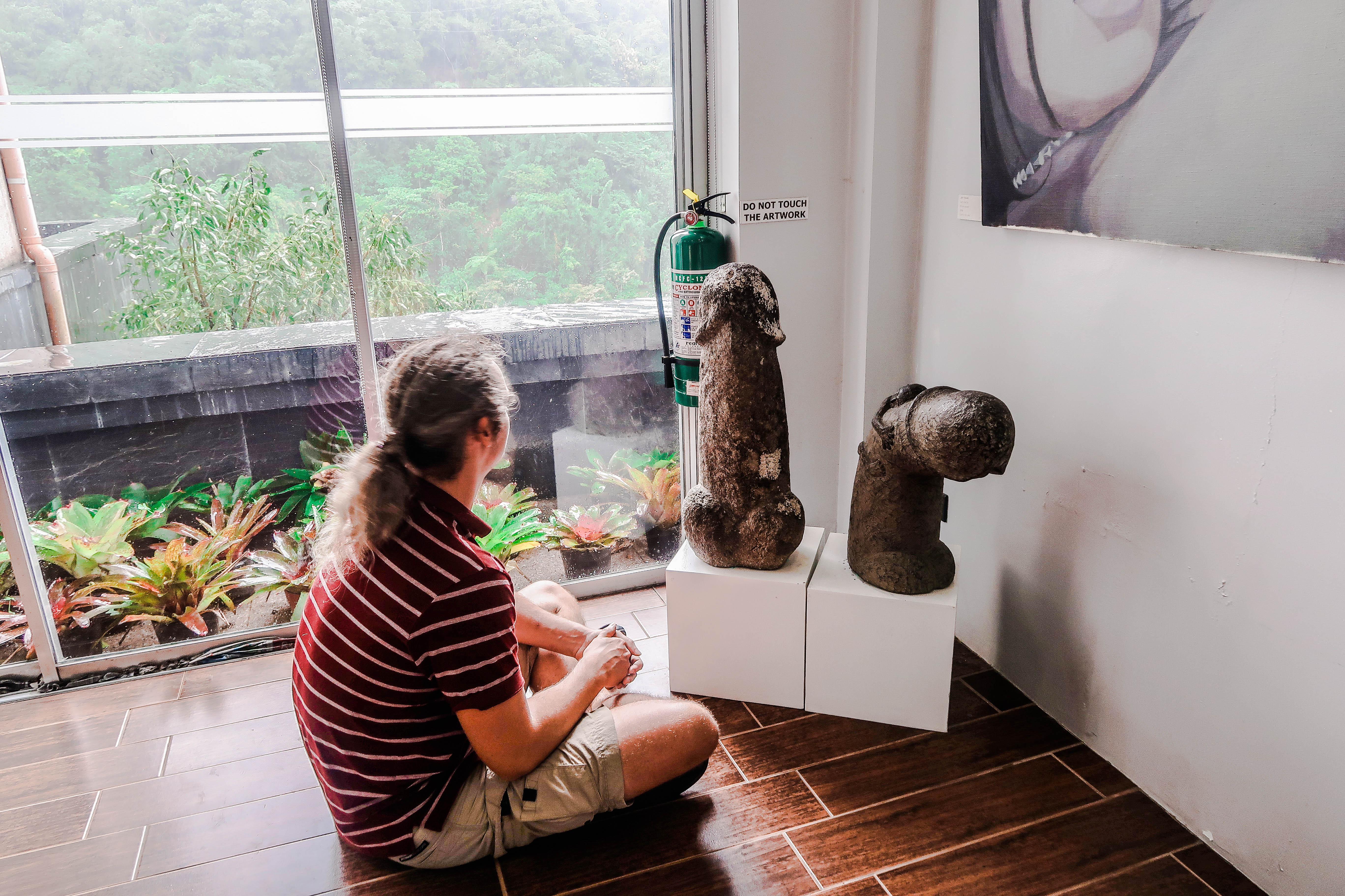 lenny through paradise looking at sculpture of penis in bencab museum baguio city philippines